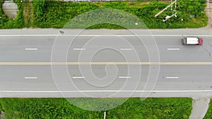 4K Drone shot high angle Aerial view of highway traffic at the countryside, The car truck and motorcycle transport