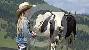 4K Farmer Shepherd Child with Grazing Cows, Cowherd Girl with Cattle in Mountain