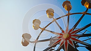 4K. ferris wheel rotation on blue sky background in sunny day