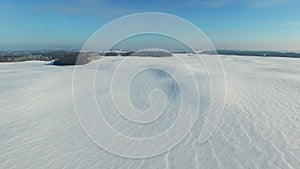 4K. Flight above snow fields in winter, aerial view (Snow desert)