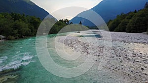 4K. Flight above Soca river in Slovenia at sunset. Julian Alps, Soca Valley, Bovec district