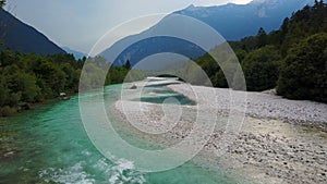 4K. Flight above Soca river in Slovenia at sunset. Julian Alps, Soca Valley, Bovec district