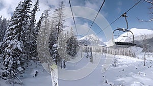 4K footage of a cableway moving to the mountain's top in skiing resort