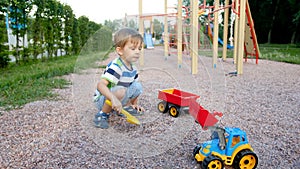 4k footage of cute 3 years boy playing on palyground with plastic toys