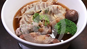 4k footage of a dish of delicious Wonton soup rotating close up