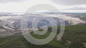 4k footage from a flying drone over a mountain quarry for the extraction of iron ore