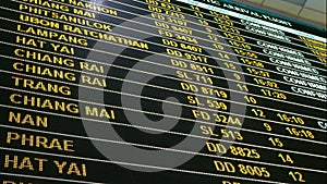 4K footage. LED digital airport flight information status board showing destination , airline flight number and flight status