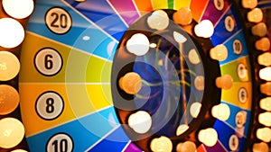 4K footage loop. retro colorful casino game cabinet flashing lights. game spinning light with bankrupt, success and fresh start