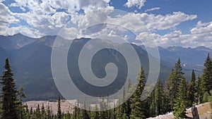 4K footage of Sundance Peak in Banff National Park, Canada, in cloudy sky background