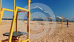 4k footage of volleball field on the beach at sunny windy day