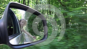 4K Girl in Car Playing outside the Window, Child Face in Mirror, Forest View