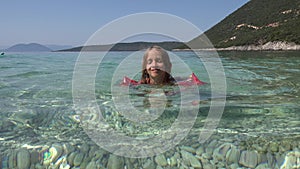 4K Girl Swimming in Sea Waves, Beach View in Sunrise, Child Playing in Summer