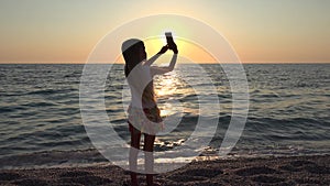 4K Girl Taking Selfie Via Smartphone, Beach View at Sunset, Child Playing Tablet