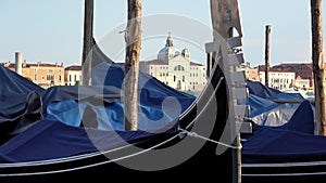 4K. Gondolas moored in Venice, Italy. Church of San Giorgio Maggiore.