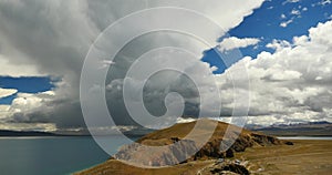 4k huge clouds mass rolling over lake namtso & peninsula,tibet mansarovar.