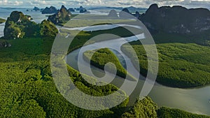 4K Hyperlapse aerial view drone flying over mangrove forest and mountain peak pull back tilt reveal shot, Phang nga, Thailand