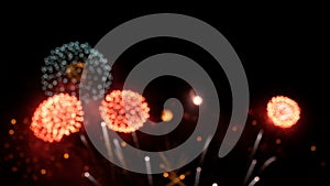 4K. loop seamless of real fireworks background. abstract blur of real golden shining fireworks with bokeh lights in the night sky.