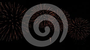 4K. loop seamless of real golden fireworks festival in the sky display at night during national holiday, new year party