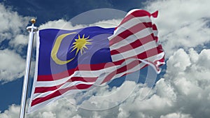 4k looping flag of Malaysia waving in wind,timelapse rolling clouds background.