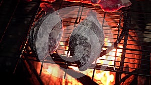4K Man village cooking barbecue fish with salt-crusted and pork grilled meat