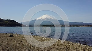 4K Mountain Fuji reflected in Kawaguchiko lake on a sunny day and clear sky Aerial view from Drone