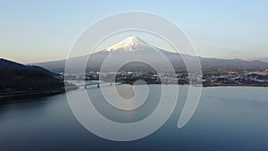 4K Mountain Fuji reflected in Kawaguchiko lake on a sunny day and clear sky Aerial view from Drone