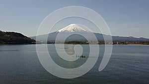 4K Mountain Fuji reflected in Kawaguchiko lake on a sunny day and clear sky Aerial view from Drone