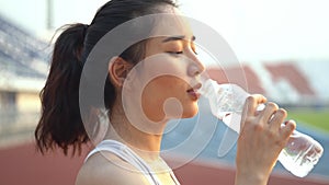 4k Move camera to Young Asian teenage girl drink water