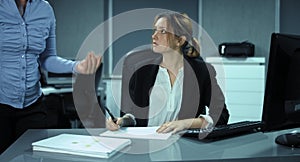 4K: Office stress. A woman works on a pile of documents and hopes for end of work.