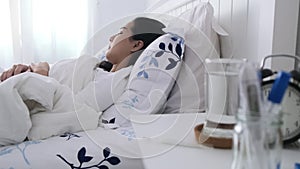 4k Panning camera of young sickness woman sleep