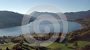 4k Panoramic drone flight from North Part of the Lake Tegernsee at sunset with fog in autumn. The lake is one of the