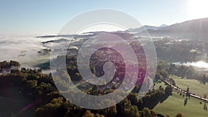 4k Panoramic drone flight from North Part of the Lake Tegernsee at sunset with fog in autumn. The lake is one of the