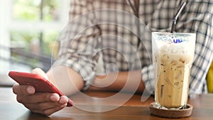 4K. people using mobile smartphone at coffee shop, use finger touch on screen and slide , swiping, scrolling gestures.