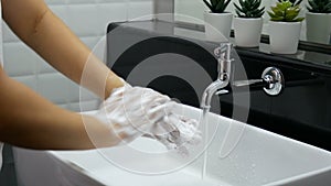 4K. personal hygiene. washing hands, rubbing hand thoroughly with soap that has a lot of bubbles for cleaning and disinfection