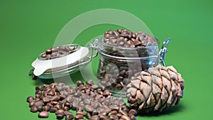 4k. Pine nuts in a glass jar on green