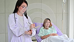 4K Portrait young female doctor with patient in the background