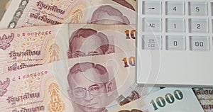 4k rotating Baht money & calculator.