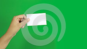 4K. set of woman hand showing blank white business name card paper isolated on chroma key green screen background