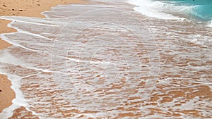 4k slow motion video of sea waves rolling on the sandy beach at bright sunnny day