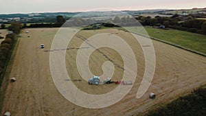 4k spinning around farmers baying hay in their field during summertime in England.