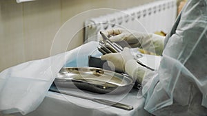 4K. Surgical operation. Close-up of medical surgical instruments. Completion of the operation