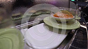 4k, Sushi on conveyor belt in Japan Restaurant, also known as sushi train