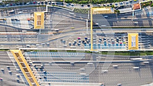 4K time-lapse of car traffic transportation on multiple lanes highway road and toll collection gate, drone aerial top view