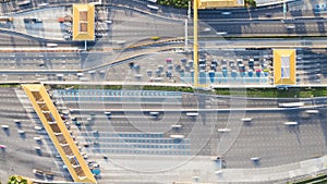 4K time-lapse of car traffic transportation on multiple lanes highway road and toll collection gate, drone aerial top view