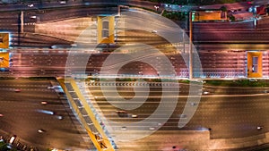 4K time-lapse of car traffic transportation on multiple lanes highway road and toll collection gate at night