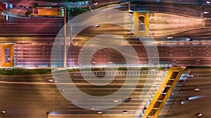 4K time-lapse of car traffic transportation on multiple lanes highway road and toll collection gate at night