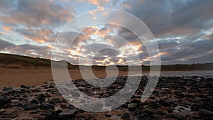 4k time lapse footage of dramatic sunset with moving clouds at Melvich Beach, Sutherland, Scotland