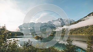 4K Time lapse of lake Eibsee in Bavaria Germany clouds during sunrise