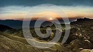 4k Timelapse movie film clip of Sunset at the heavily eroded ridges of the famous Zabriskie Point, Death Valley National