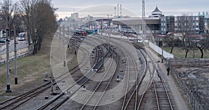 4k timelapse at Railway Station at evening time, with trains and vehicles passing by